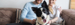 Hond op schoot bij eigenaren